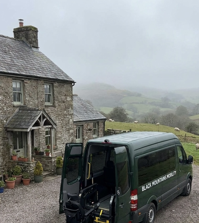 Black Mountains Mobility van delivering a wheelchair to a rural Herefordshire farmhouse